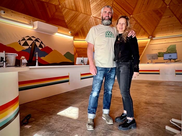Domes Dispensary owners standing inside the unique cannabis dispensary in Kingston, New York.