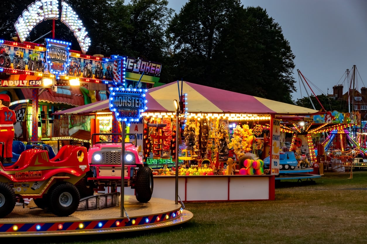 Saffron Walden, Essex, UK - September 06, 2024: A row of amusement rides, games and attractions at a travelling funfair